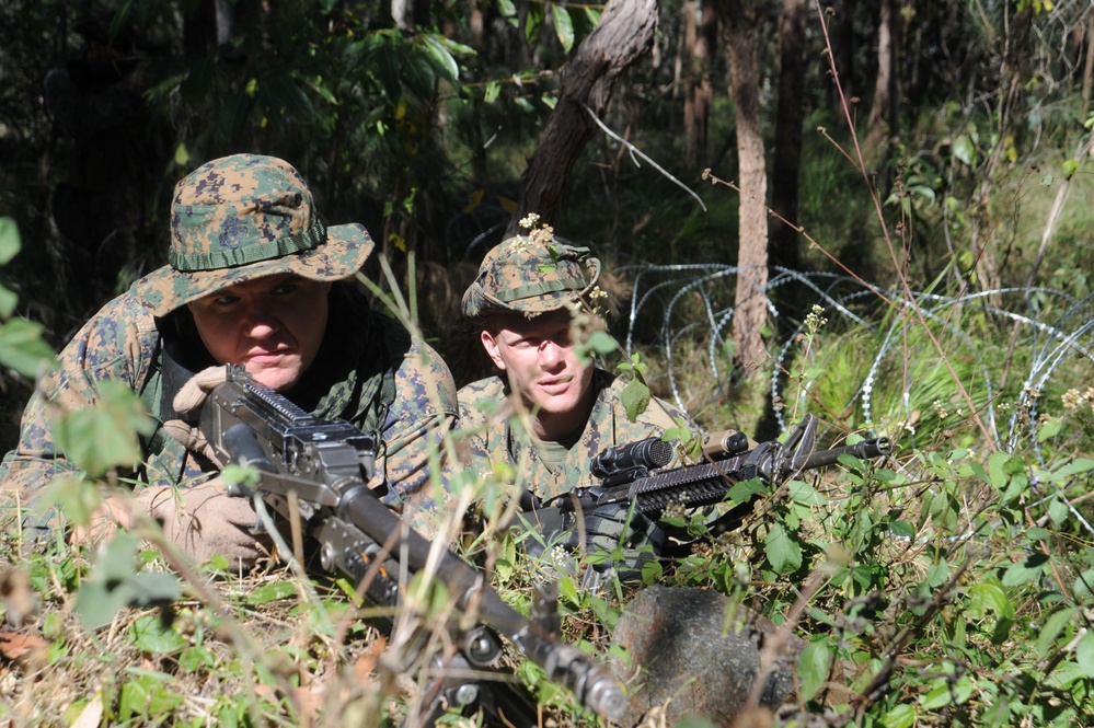 U.S. Marines search for enemy soldiers.