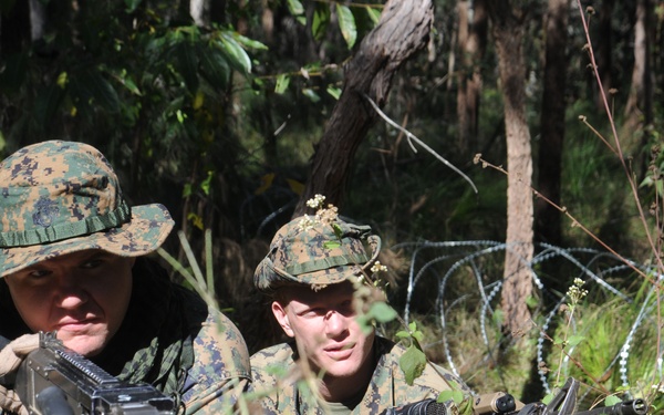 U.S. Marines search for enemy soldiers.
