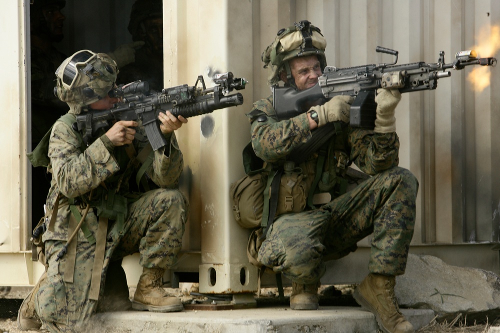 U.S. Marines return fire with blank rounds at the Urban Operations Training Facility.