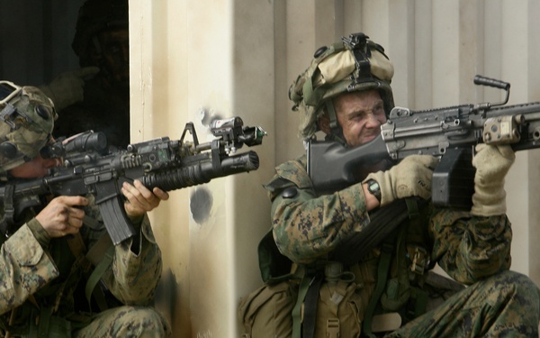 U.S. Marines return fire with blank rounds at the Urban Operations Training Facility.