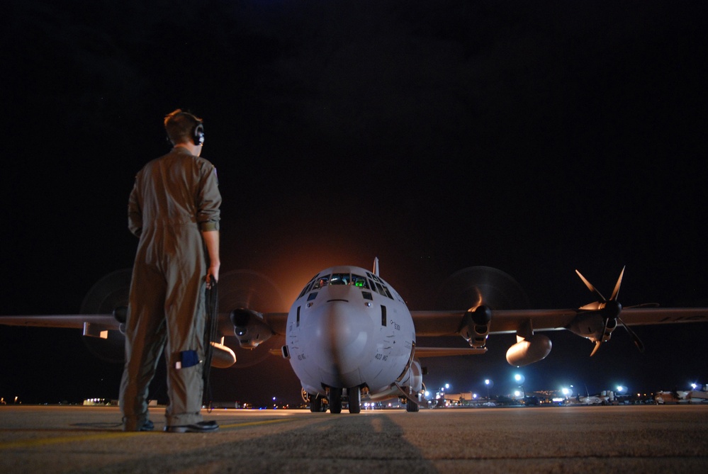Tech. Sgt. Matt Couch communicates with the pilot.
