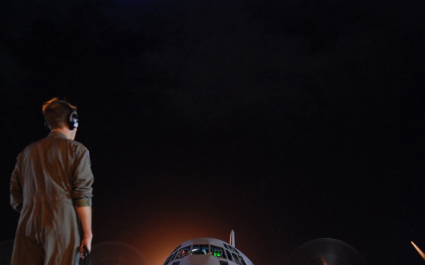 Tech. Sgt. Matt Couch communicates with the pilot.