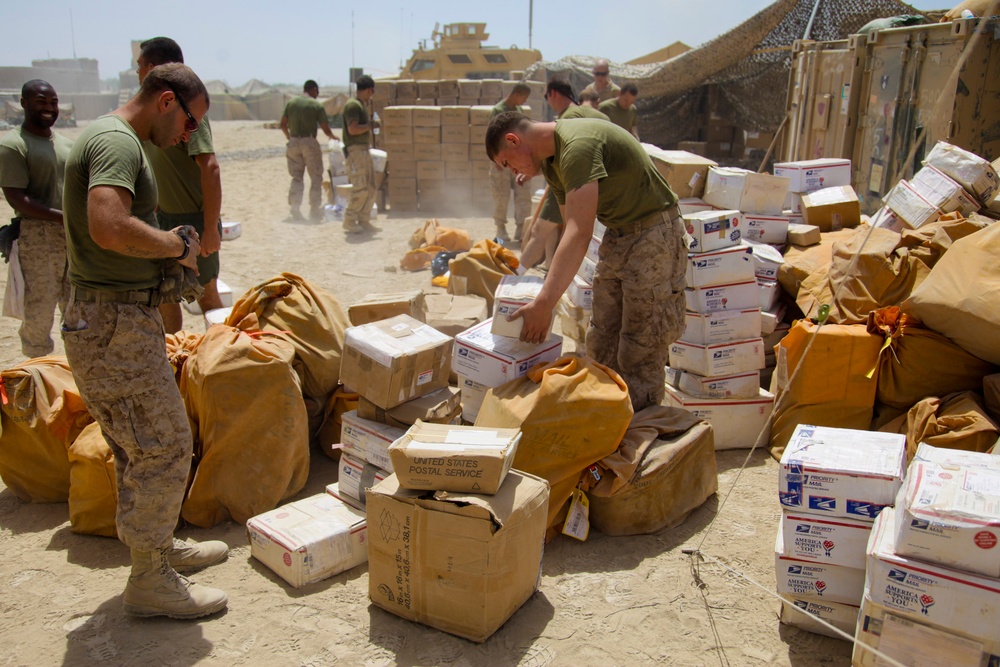 U.S. Marines sort mail at Patrol Base Jaker.