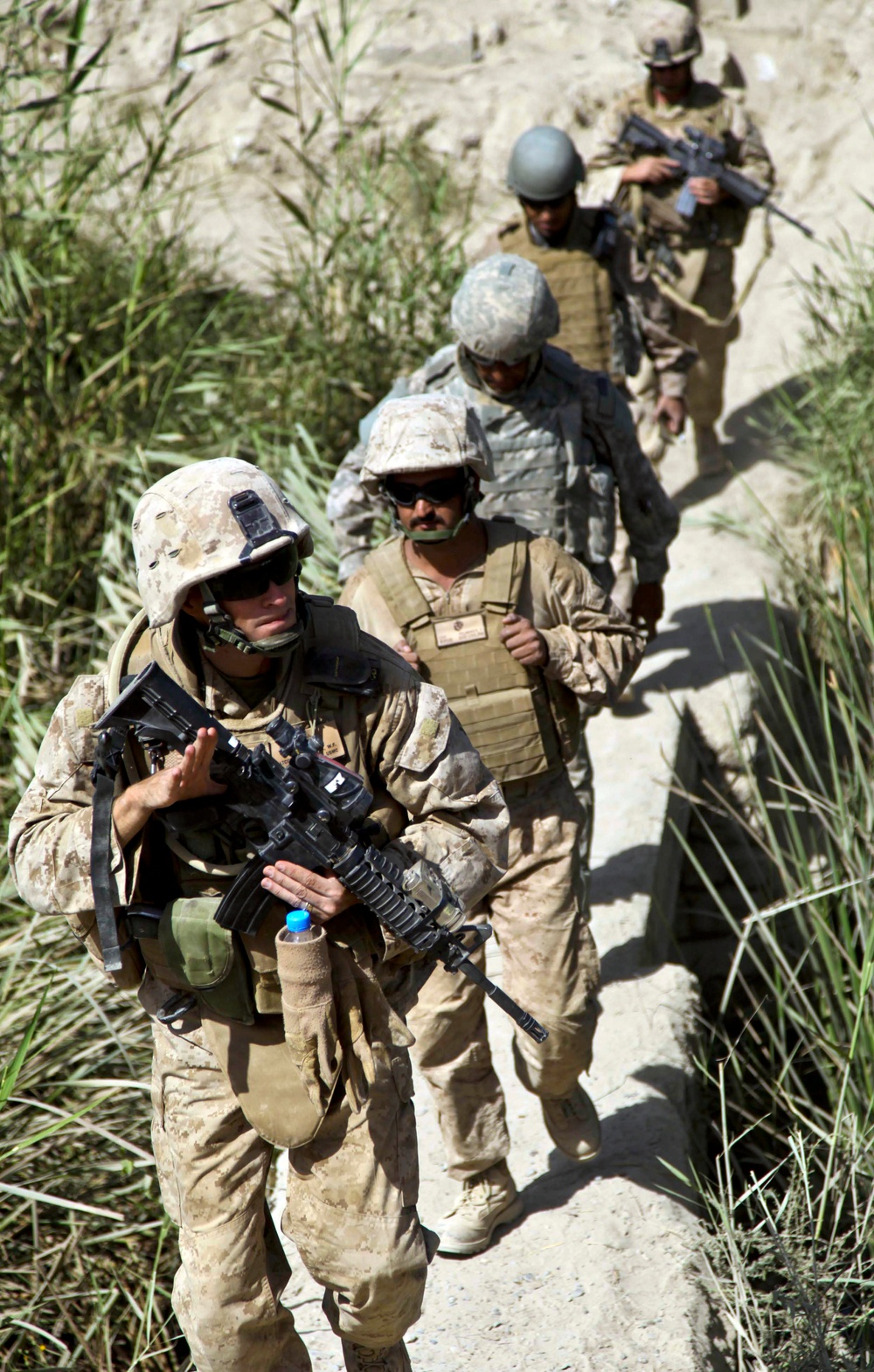 Lt. Col. William McCollough crosses a bridge in the Nawa district.