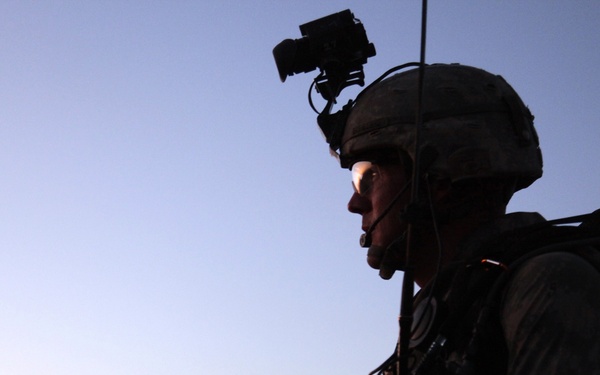 Staff Sgt. Roger Schilling scans the terrain during a night patrol.