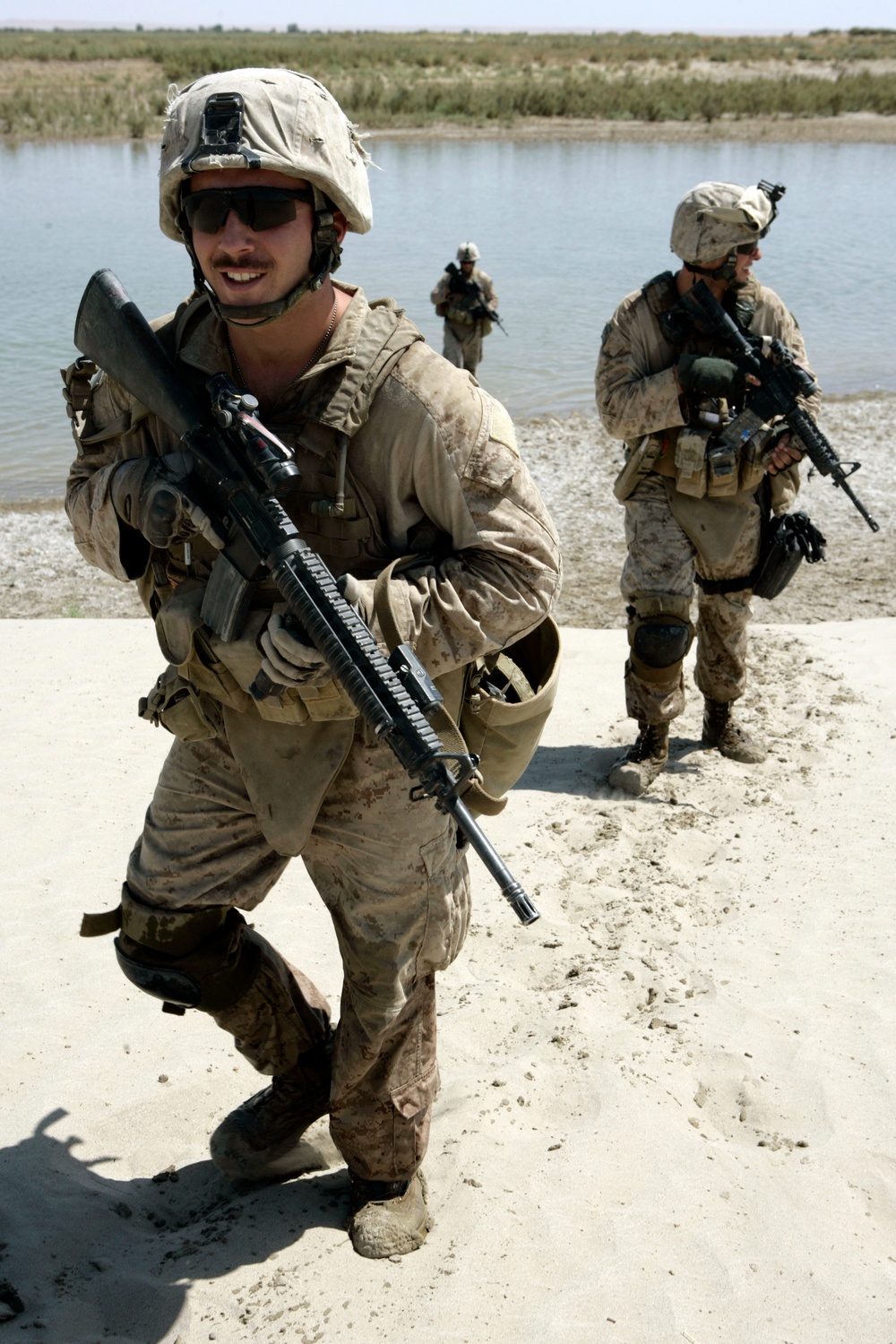 U.S. Marines and Afghan National Police officers conduct a security patrol in the Garmsir district.