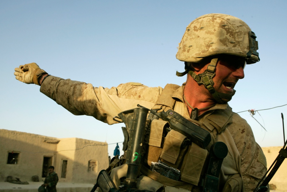 Sgt. Deacon Holten directs fellow Marines during an attack.