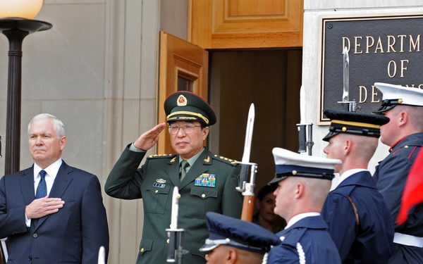 Secretary Gates and Chinese Vice Chairman of the Central Military Commission Gen. Xu Caihou salute at the playing of their national anthems.