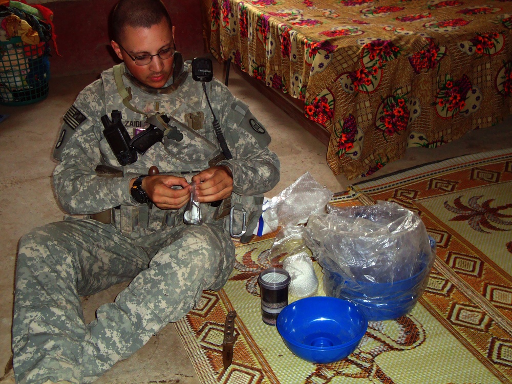 U.S. Army 2nd Lt. Zaidi builds a drinking water filtration system.