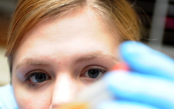 Airman 1st Class Amber App verifies patient identifications on blood samples.