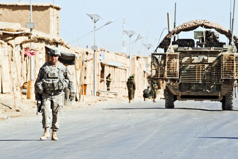 Command Sgt. Major Gary Mayo conducts a combined combat patrol.