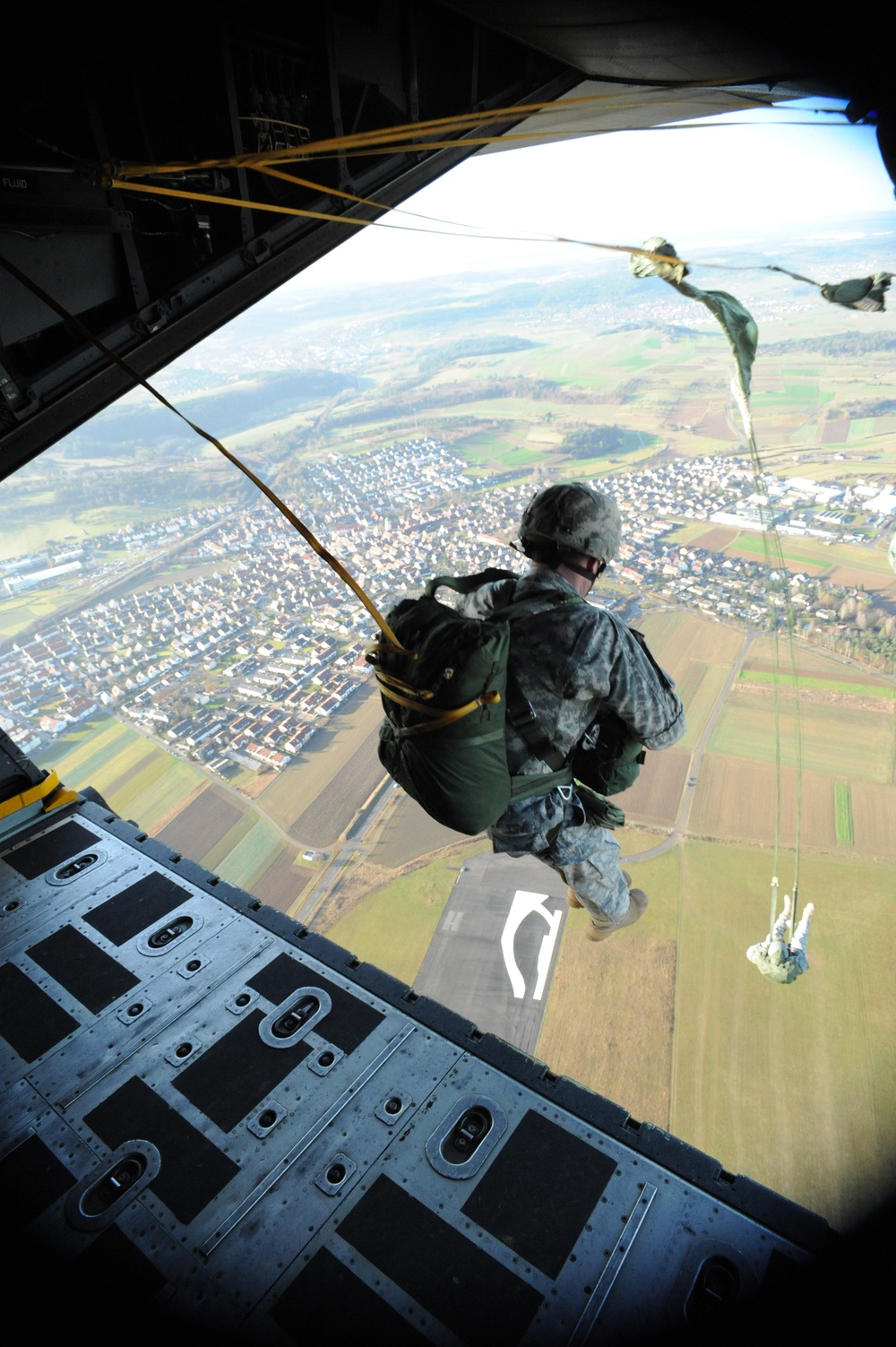 Members of Special Operations Command Europe jump from the ramp of an MC-130 Combat Talon aircraft.