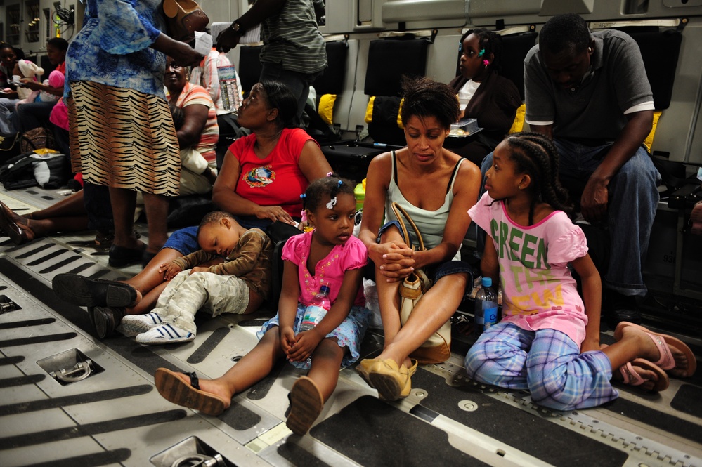 Haitian Americans wait to be evacuated from Toussaint L’Ouverture International Airport.