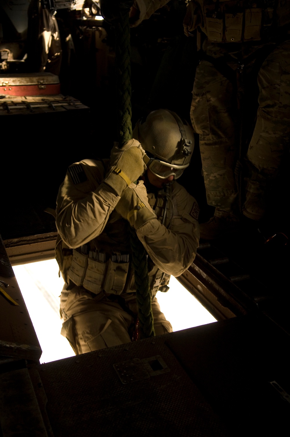A U.S. Air Force pararescueman begins his descent of 40 feet.