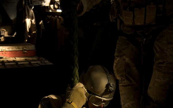 A U.S. Air Force pararescueman begins his descent of 40 feet.