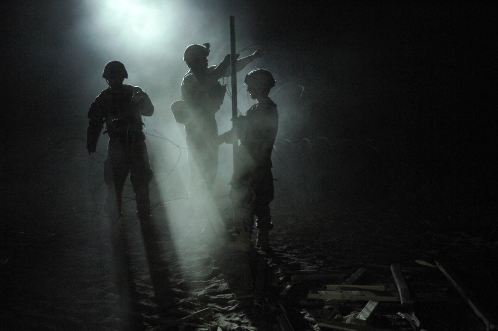 U.S. Army soldiers fortify an Afghan Highway Police checkpoint in Robat.