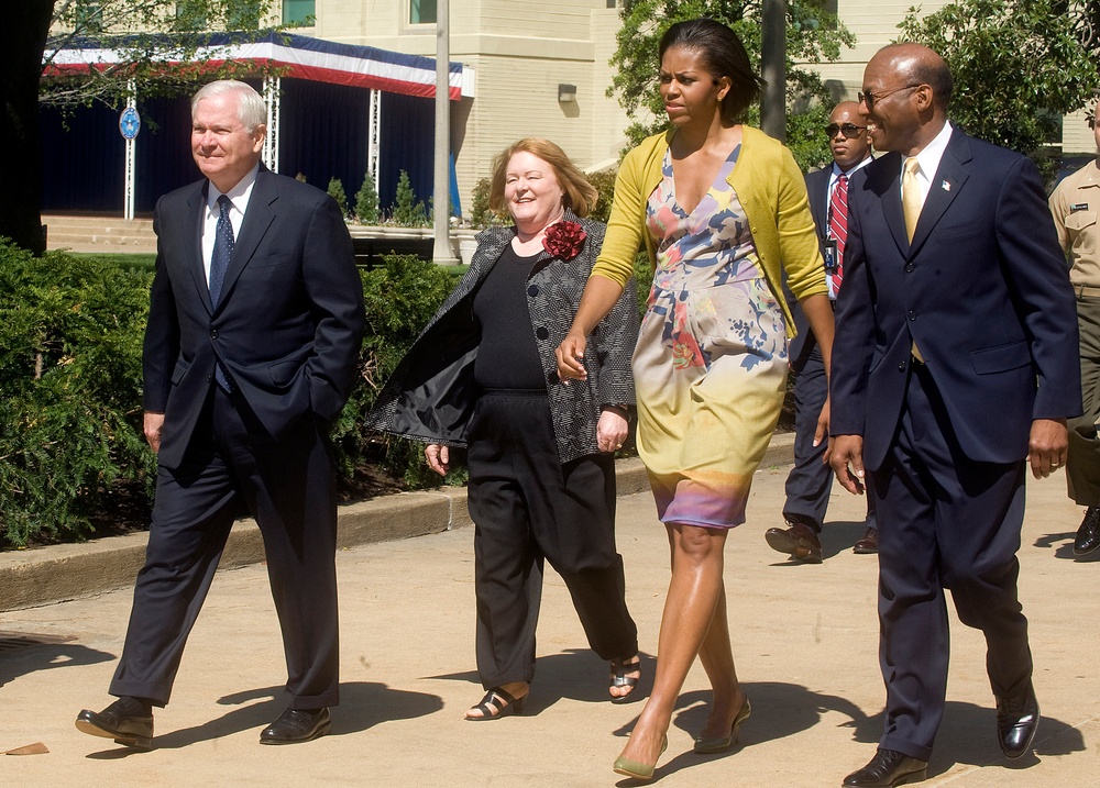 Michelle Obama walks with Secretary Gates and his wife Becky Gates.
