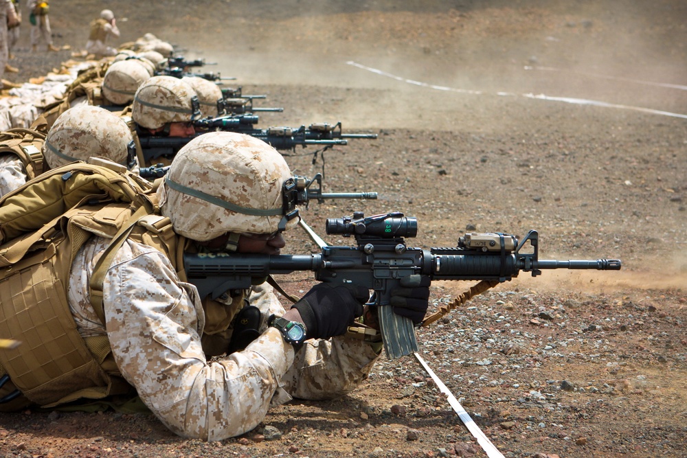 Staff Sgt. Reginald Gibbons fires his M-4 carbine from the prone position.