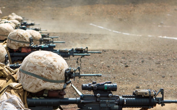 Staff Sgt. Reginald Gibbons fires his M-4 carbine from the prone position.