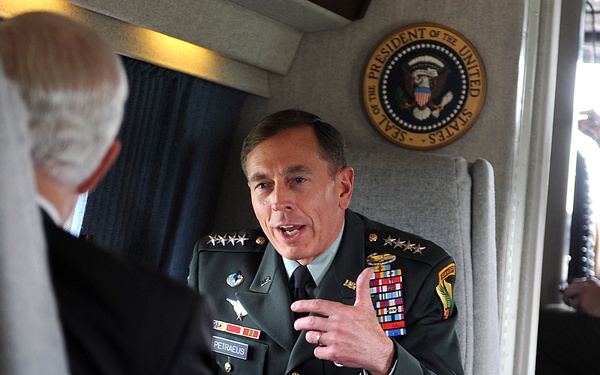 Gen. David Petraeus speaks with Secretary Gates aboard a U.S. Marine Corps helicopter.