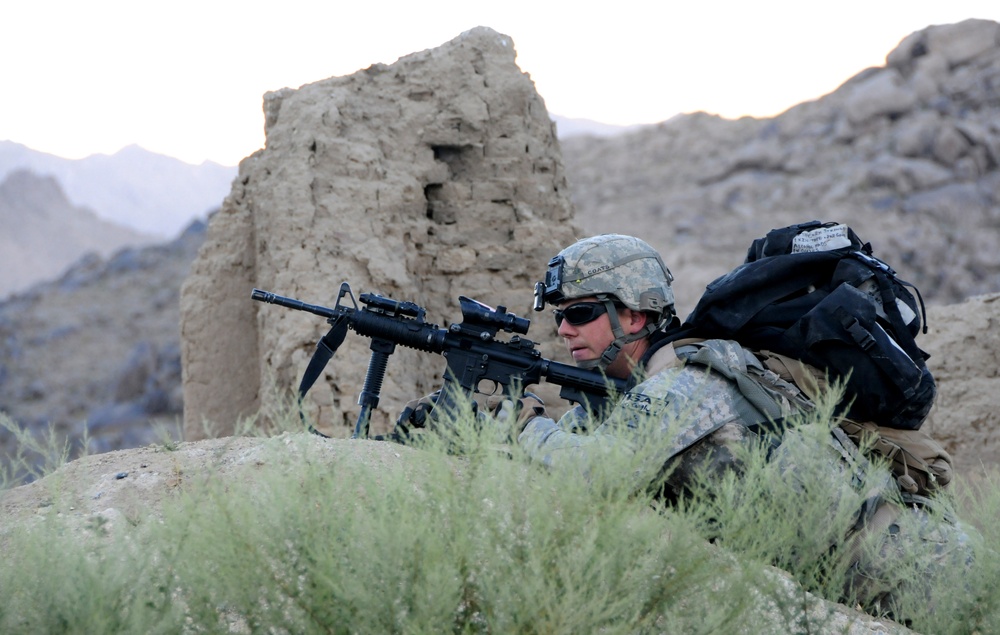 Pfc. Justin Coats keeps watch on a patrol near Forward Operating Base Baylough.