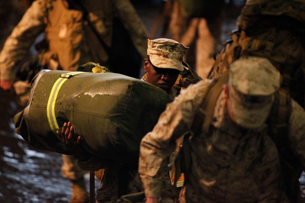 U.S. Marines disembark from a landing craft unit.