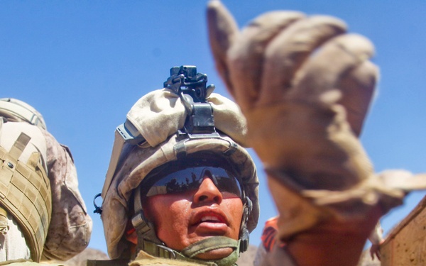 Sgt. D.B. Castillo instructs his Marines to continue fire suppression fire.