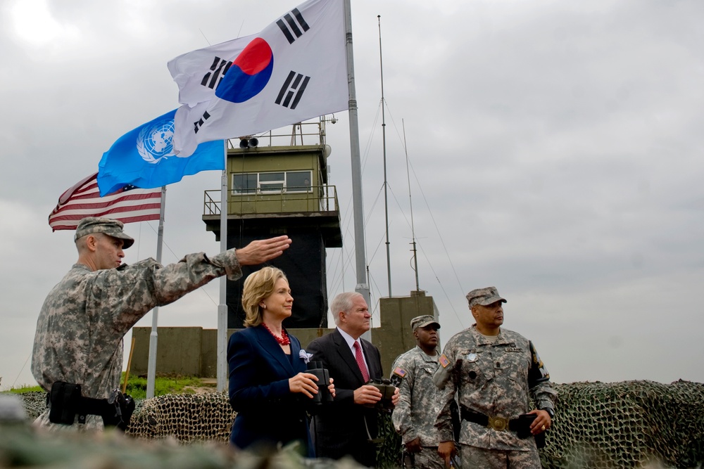 Secretary of State Hillary Clinton and Secretary Gates look out over North Korea.