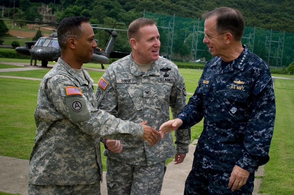 Adm. Mike Mullen is greeted by Col. Hank Dodge and Sgt. Maj. Nidal Saeed..