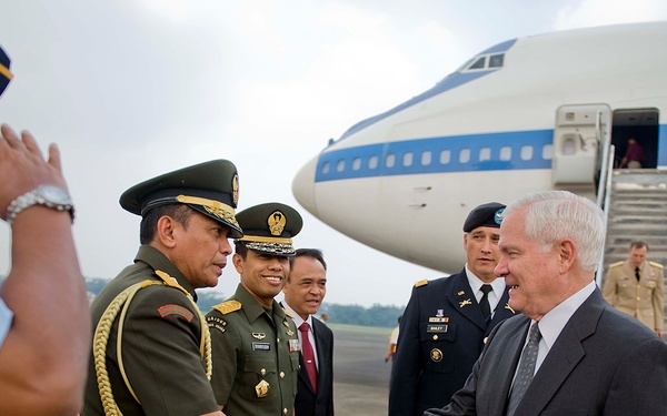 Secretary Gates is greeted by Indonesian military members.