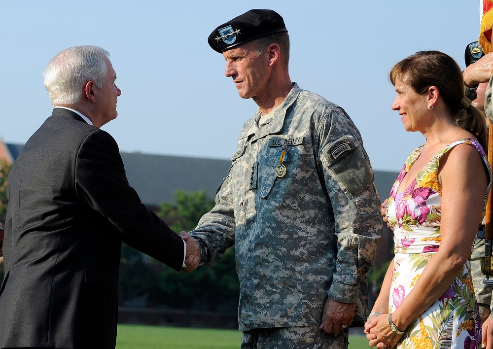 Secretary Gates congratulates Gen. Stanley McChrystal with is wife Annie.