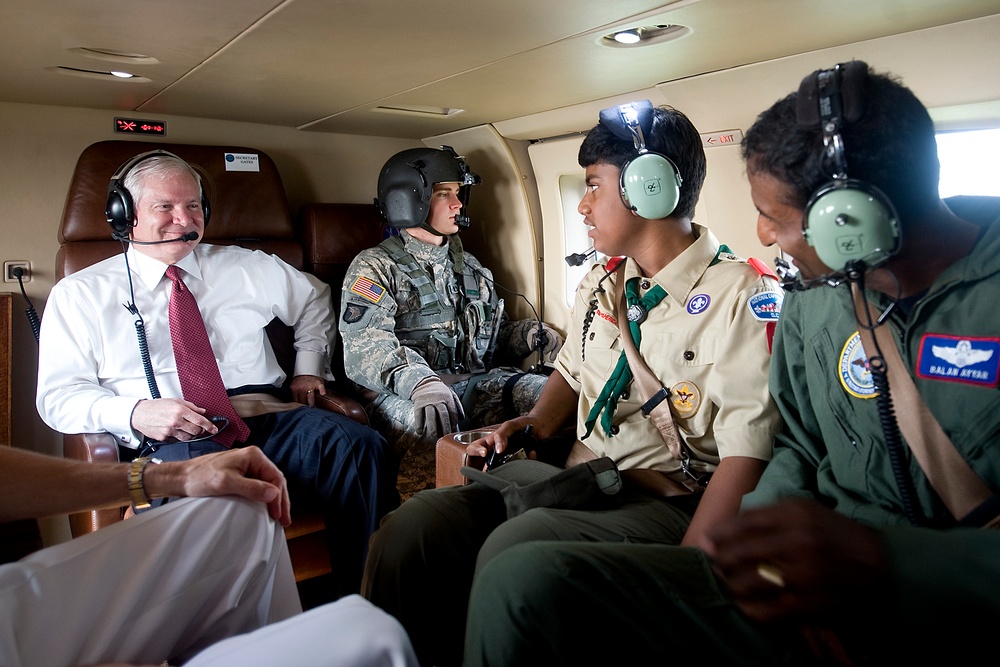 Secretary Gates speaks with Boy Scout Vasan Ayyar and his father.