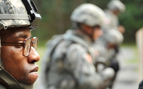 Staff Sgt. Henry Scott reviews his group and zero target.