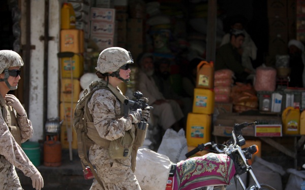 Cpl. Mary E. Walls and Sahar patrol in Musa Qa'leh.