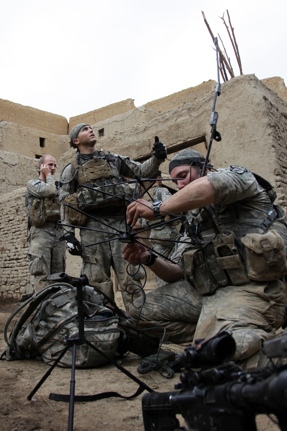 U.S. Army soldiers set up a tactical satellite communication system in Shekhabad Valley.