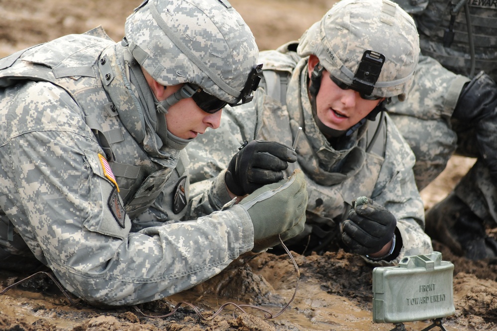 U.S. Army soldiers set up an M18A1 claymore anti-personnel mine.
