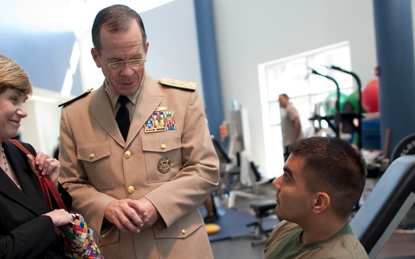 Adm. Mike Mullen and his wife Deborah talk with Cpl. Raul Olivares.