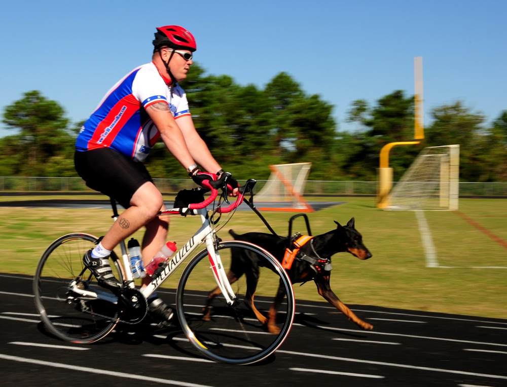 Gunnery Sgt. Daniel P. Frawley rides in the 2010 Warrior Ride with his dog Poncho.