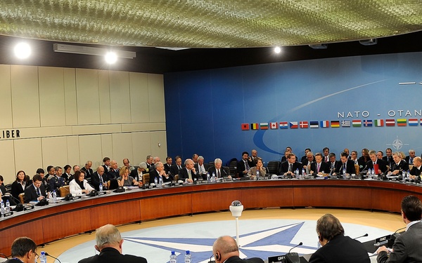 Secretary Gates and other NATO Ministers of Defense and of Foreign Affairs meet together at NATO headquarters.