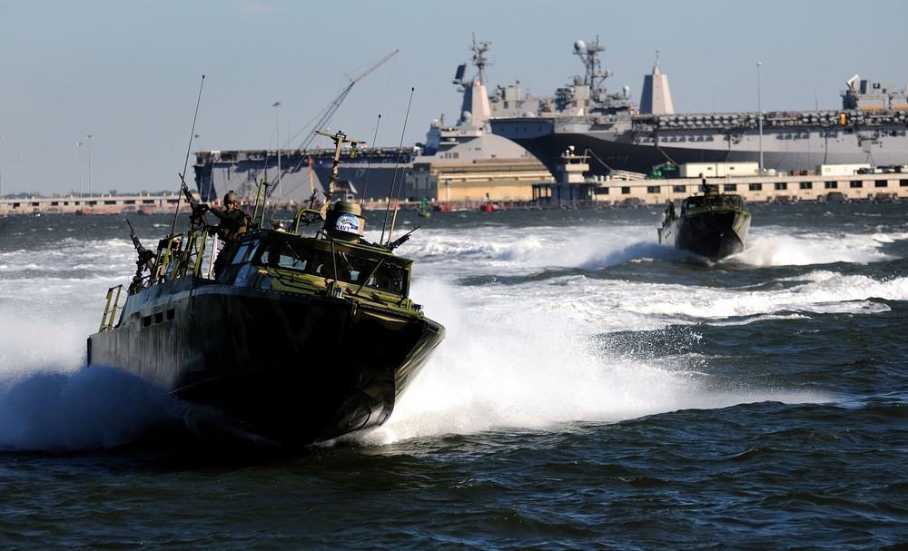 U.S. Navy sailors conduct maneuvers aboard a Riverine Command Boat (Experimental).