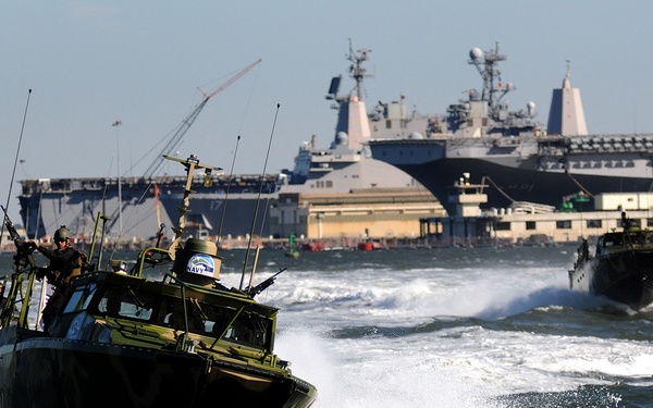 U.S. Navy sailors conduct maneuvers aboard a Riverine Command Boat (Experimental).