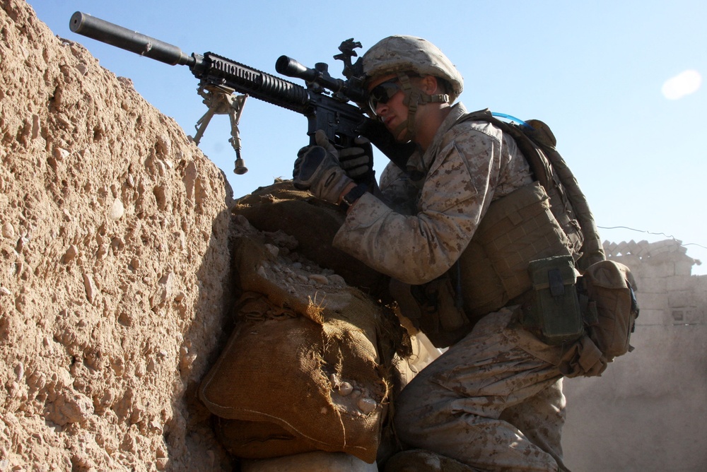 Lance Cpl. Steven J. Zandstra provides security at a checkpoint in Sangin.