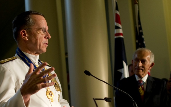 Adm. Mike Mullen thanks audience members after being presented the Officer of the Order of Australia.