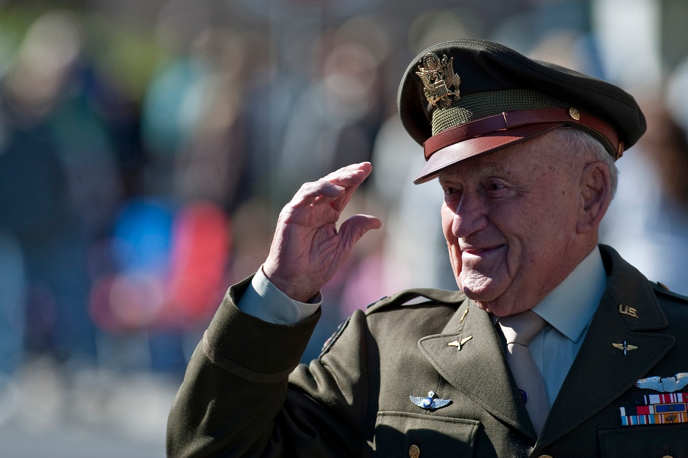 World War II fighter pilot and retired U.S. Army Air Forces Lt. Col. Jack Schofield salutes the crowd.