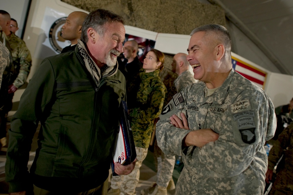 Comedian Robin Williams visits with Lt. Gen. John F. Campbell after the USO Holiday Tour show.