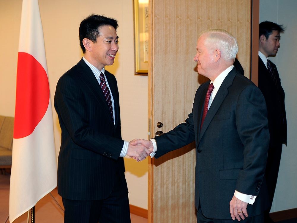 Secretary Gates is greeted by Japanese Foreign Affairs Minister Maehara Seiji.