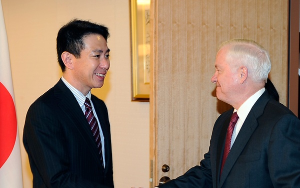 Secretary Gates is greeted by Japanese Foreign Affairs Minister Maehara Seiji.