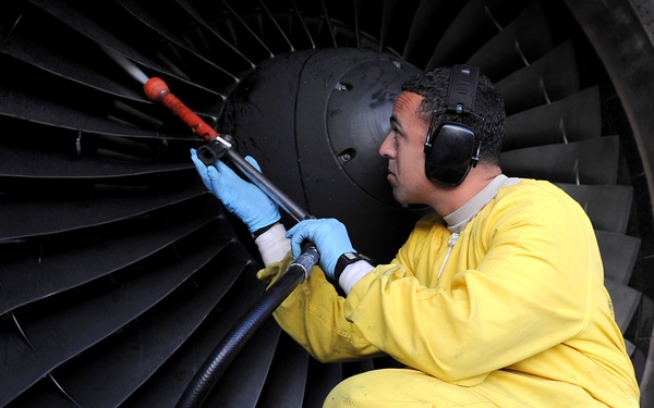 Staff Sgt. Luis Mejias inspects and washes the blades of a C-17 Globemaster III aircraft.
