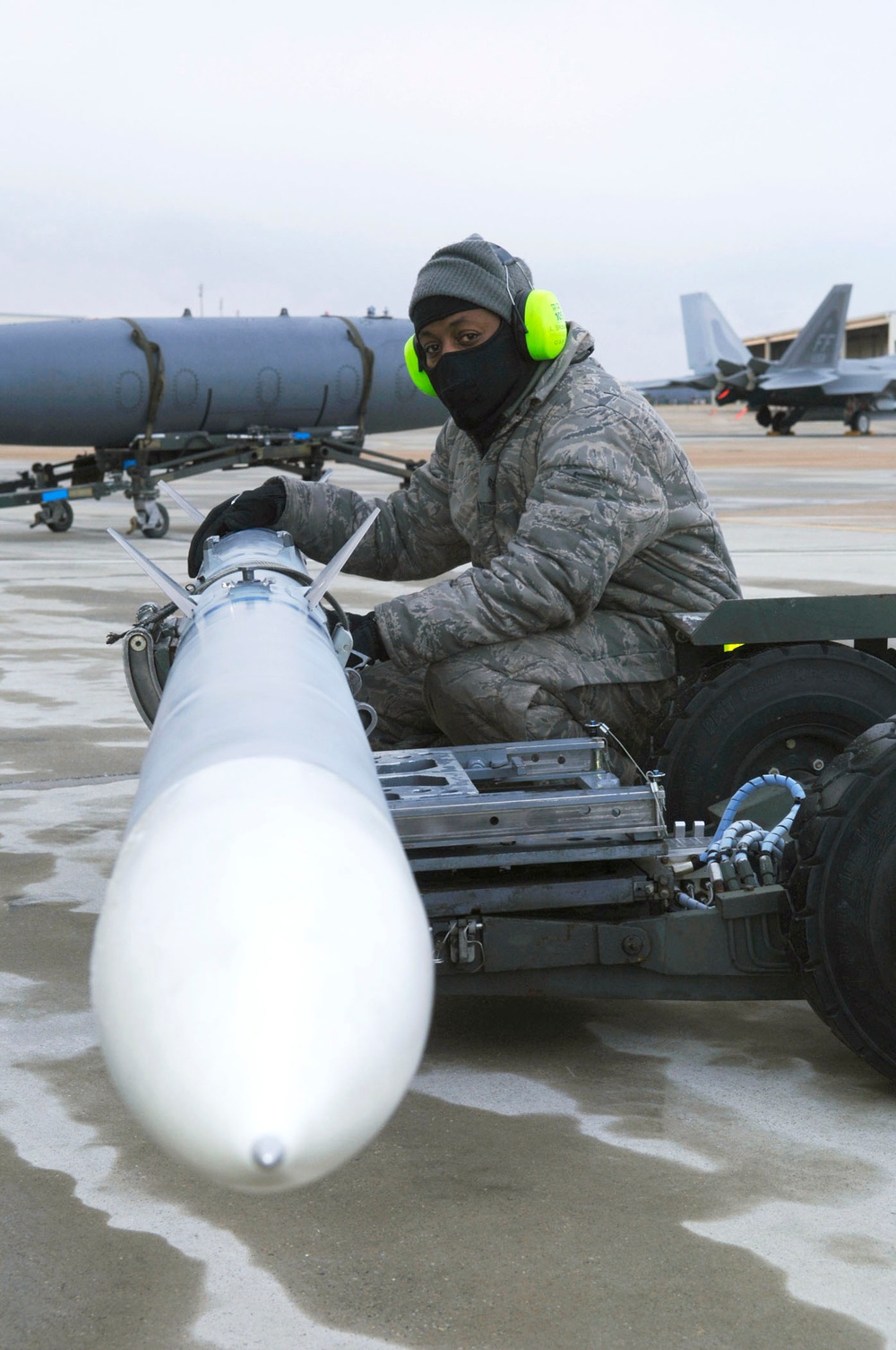 Staff Sgt. Lamont Brown waits for the command to load munitions.