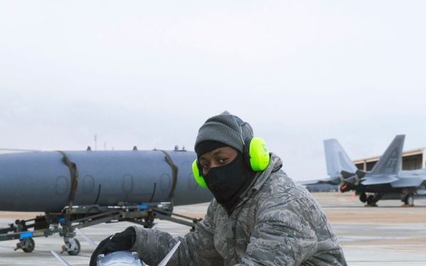 Staff Sgt. Lamont Brown waits for the command to load munitions.
